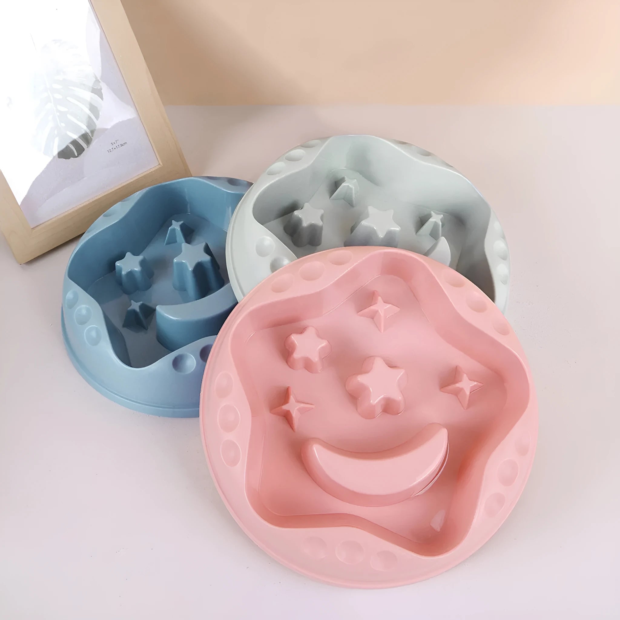 Moon Star Wings slow feed dog bowl with interior ridges and non-slip base in assorted colours.