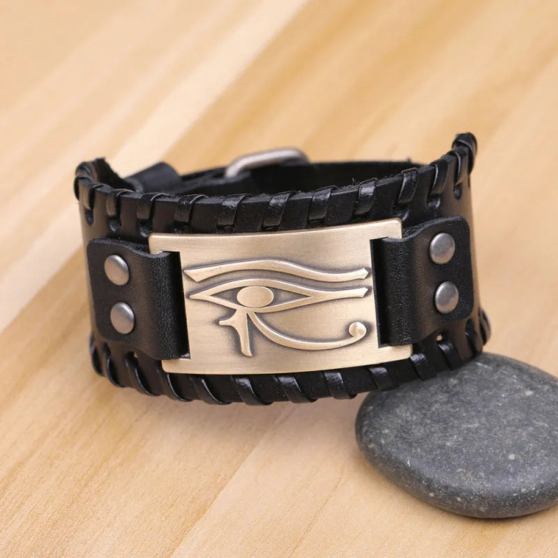 Leather bracelet with round alloy accents in ancient bronze finish on a neutral background