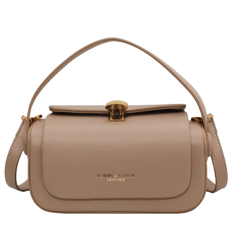Women's personalised PU leather shoulder messenger bag in beige with letter detailing and stitching.