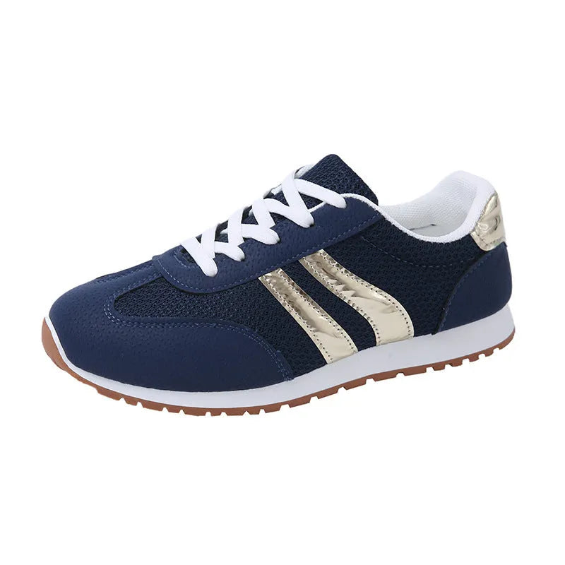 Blue women's tennis shoes with cross shoulder straps and lace-up front, artificial leather fabric uppers