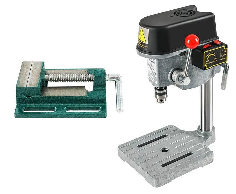 Mini bench drill milling machine with cross bench pliers on workbench