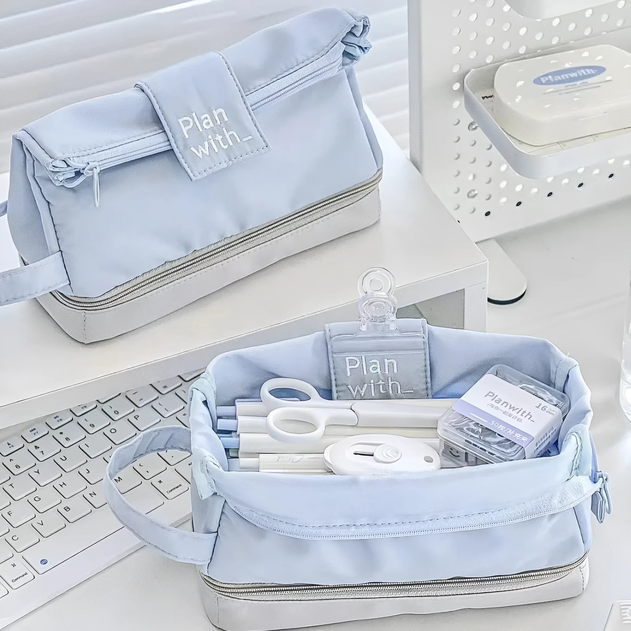 Dark blue folding double layer student pencil case made from polyester with internal compartments.