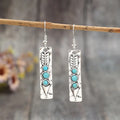 Silver geometric earrings with turquoise inlay on long strip zinc alloy design