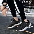 Men's low-top running shoes in red with a front strap and mesh fabric upper