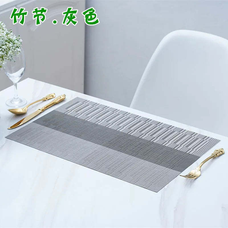 Modern PVC kitchen sink mat in a gradient bamboo colour on a countertop, showing its non-slip texture and size.