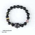 Handmade lying rabbit obsidian bracelet in brass with grey agate, showing national style design.