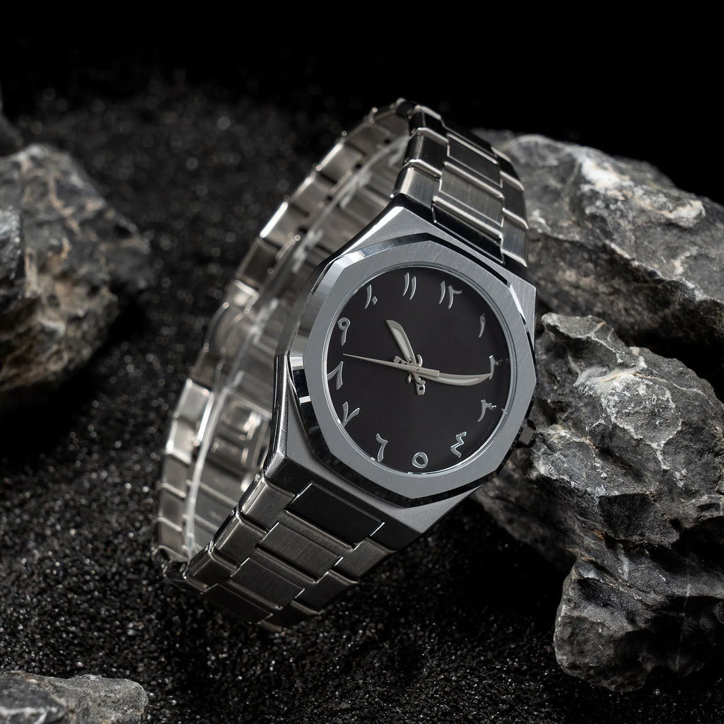 Men's steel bracelet quartz watch in business style on a wrist.