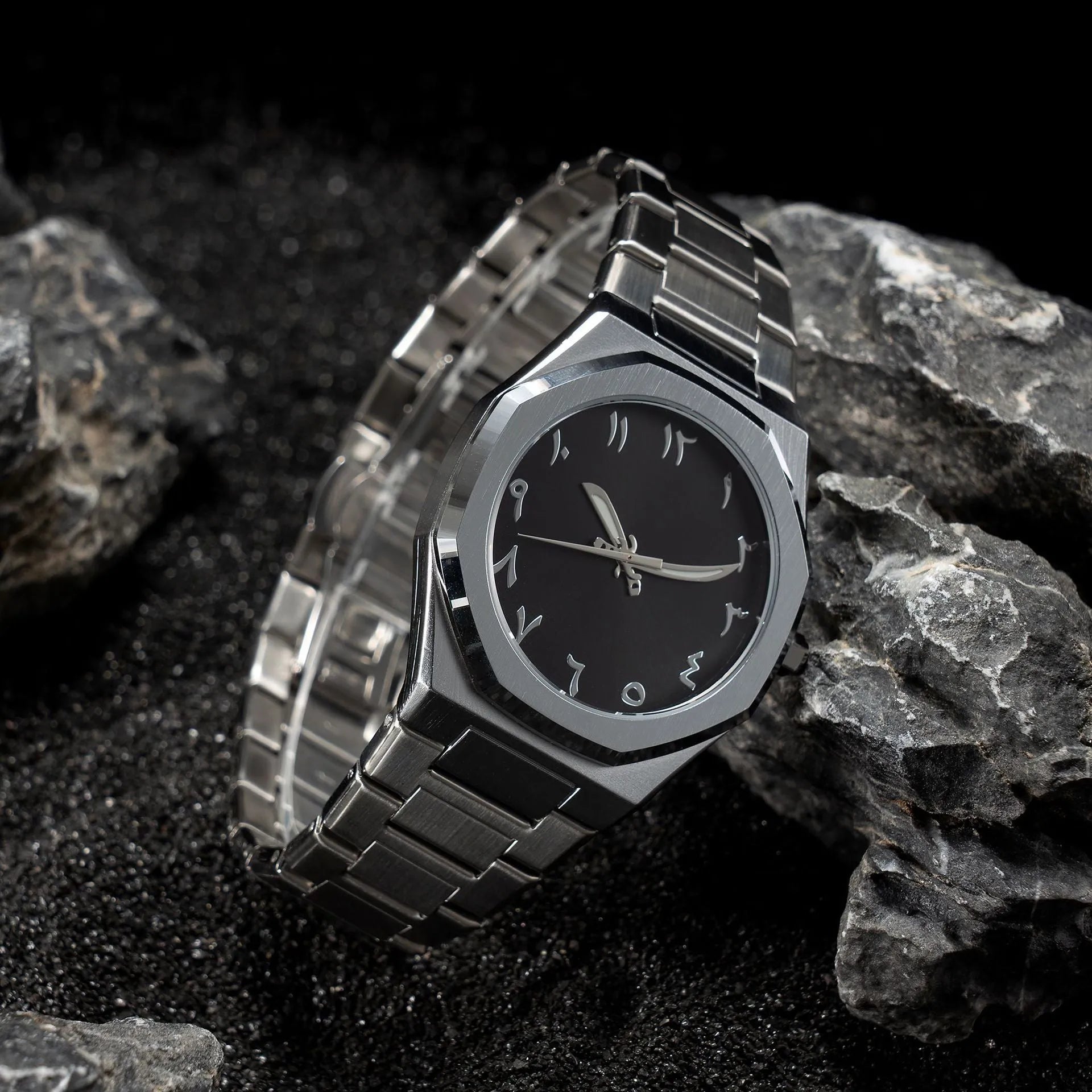 Men's steel bracelet quartz watch in business style on a wrist.