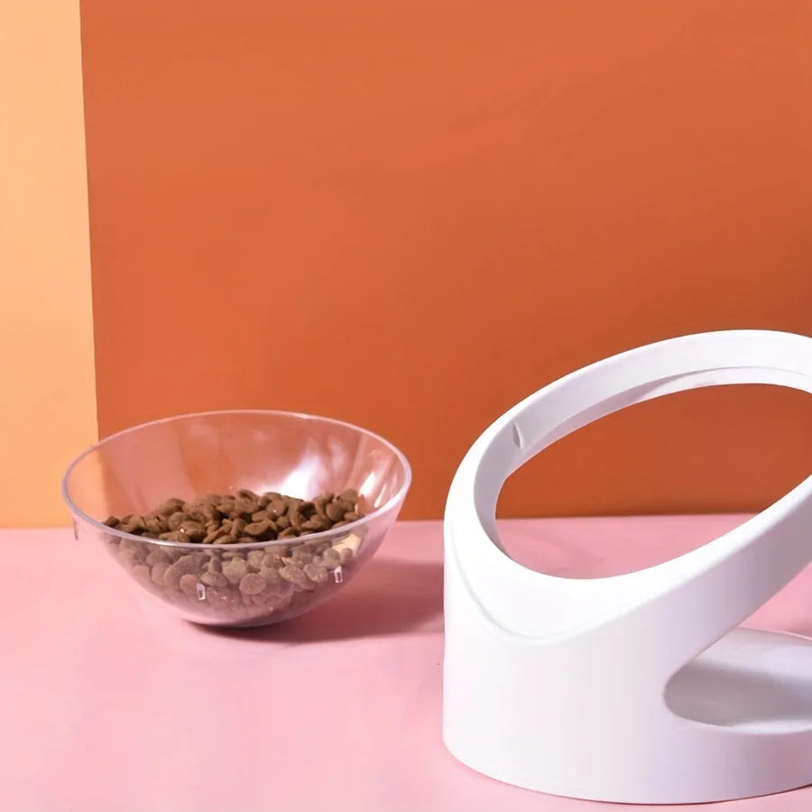 Clear plastic tilted cat food dish on a 7cm tall white plastic elevated base.