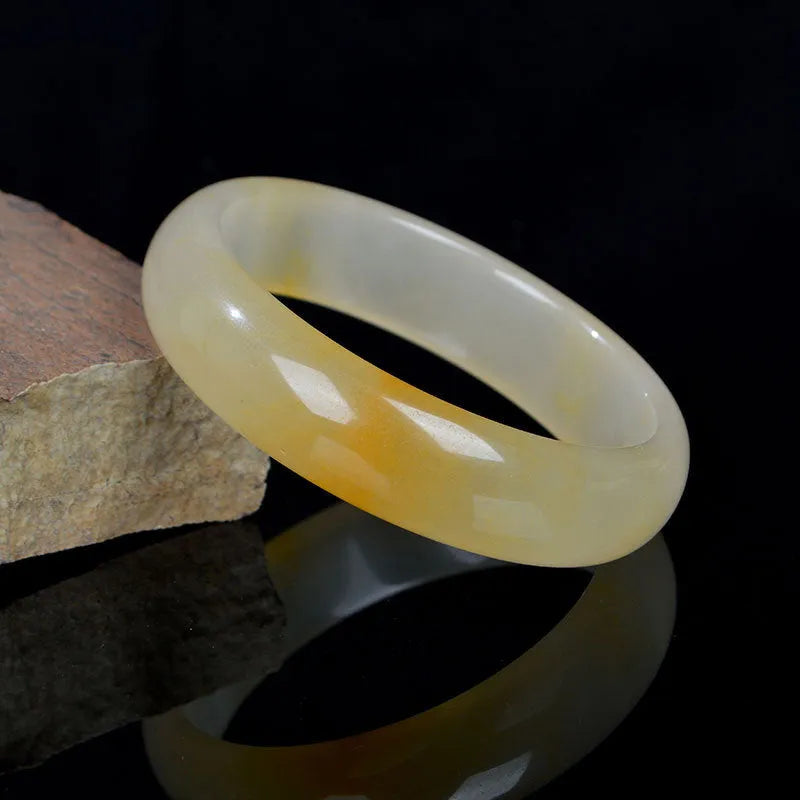 Natural light jade bracelet with Chinese styling in polished gemstone finish showing adjustable sizing from 54mm to 62mm