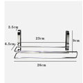 Silver stainless steel paper towel rack mounted on kitchen cabinet door back