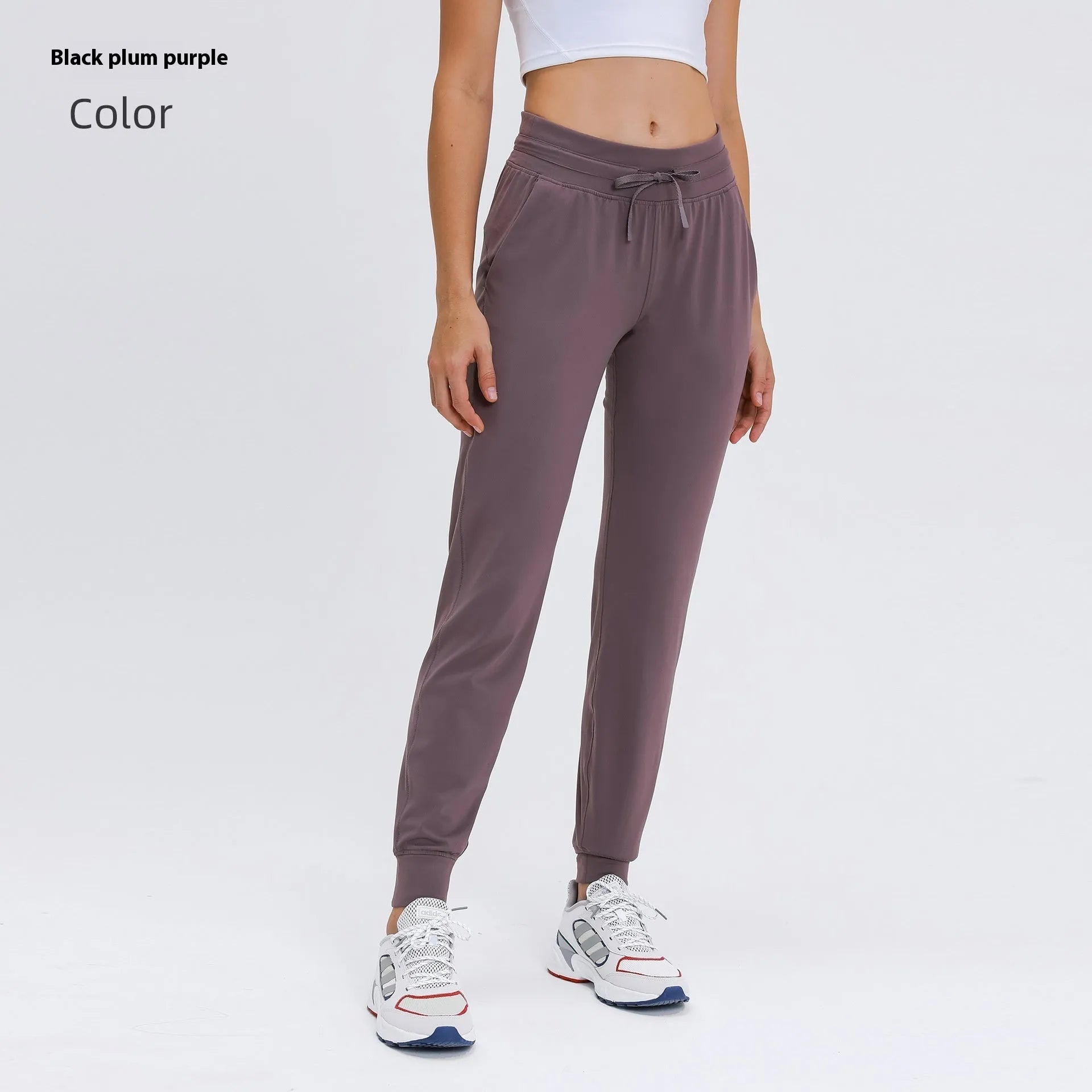 Women's high-waist yoga pants with drawstring waistband in distilled coffee colour, suitable for fitness.