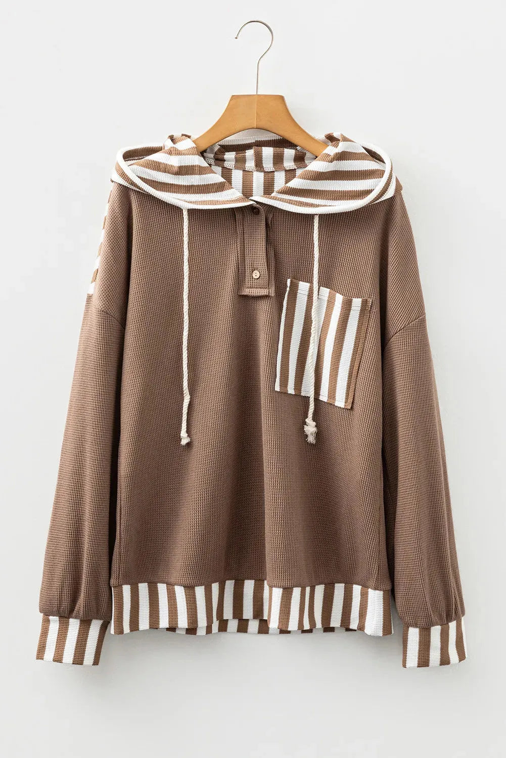 Straw yellow hoodie with waffle texture fabric, striped patchwork panels, button neck, and drawstring waist.