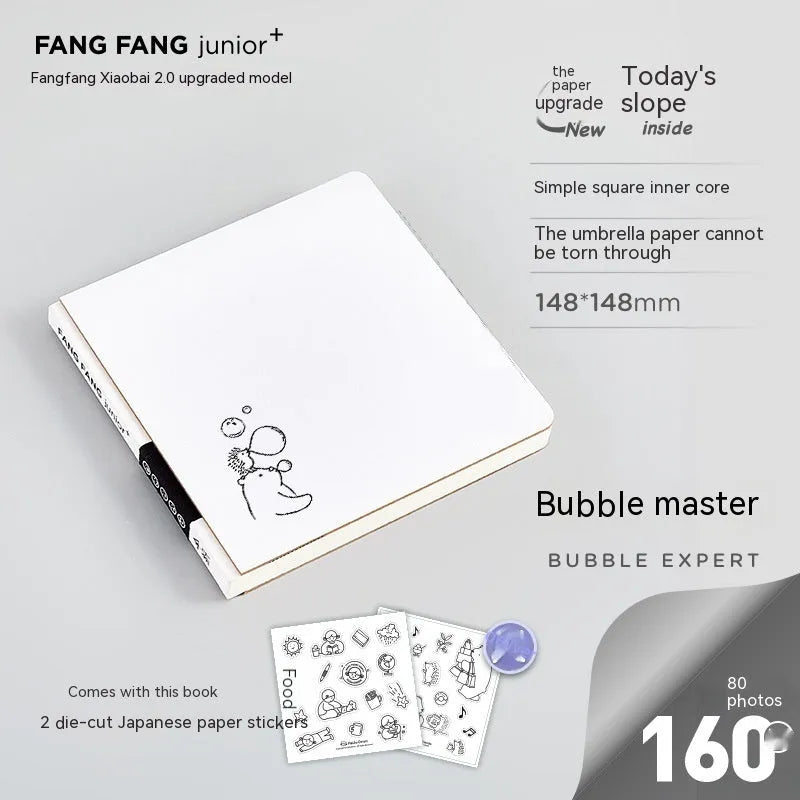 Square paper diary notebook with heart pattern cover showing checkered grid pages measuring 148x148mm