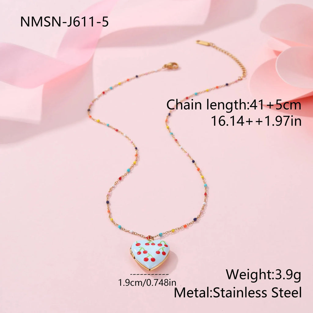 Stainless steel fruit pendant necklace with gold plating showing heart and fruit charm designs on adjustable chain