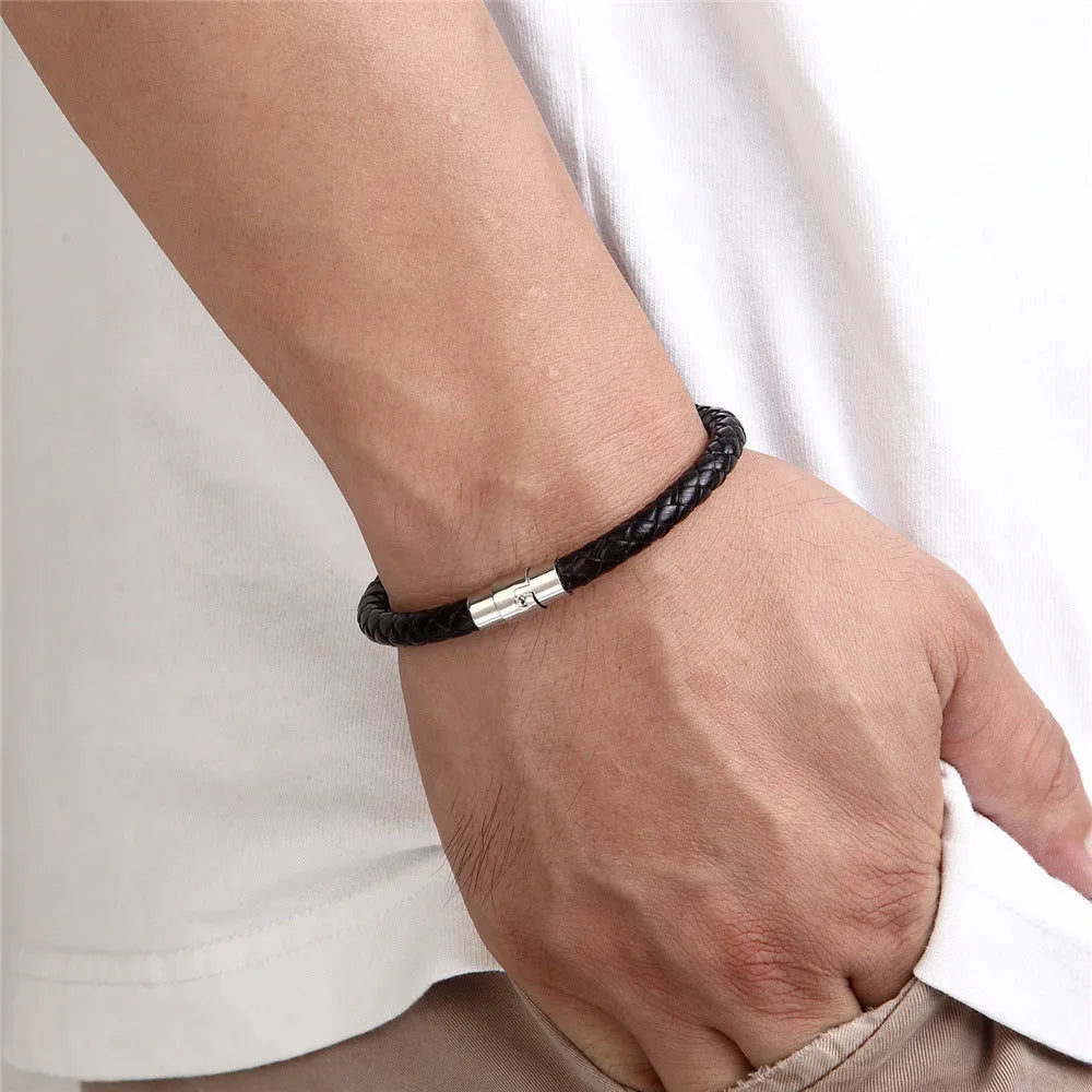 Titanium steel geometric wire bracelet with magnetic clasp on a wrist, showing unisex boyfriend style.