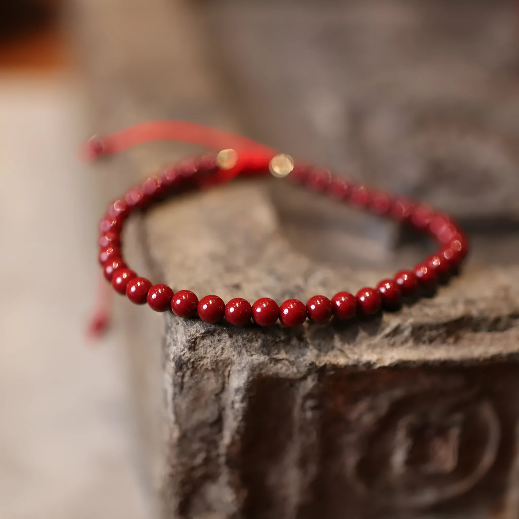 Handmade natural cinnabar bracelet with purple gold sand geometric design, traditional Chinese style jewellery