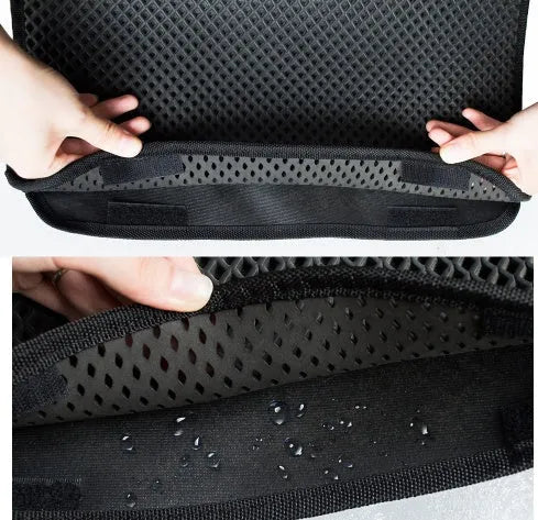 Double layer EVA cat litter mat in black with textured surface, placed under a litter box to trap debris
