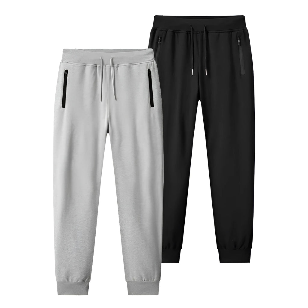 Men's thin leisure tapered knitted pants in black with ankle tie, standing on a neutral background
