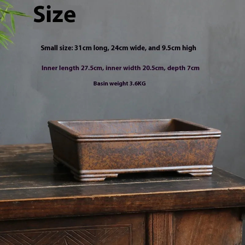 Rectangular purple sand bonsai flowerpot with firewood burning finish on wooden floor