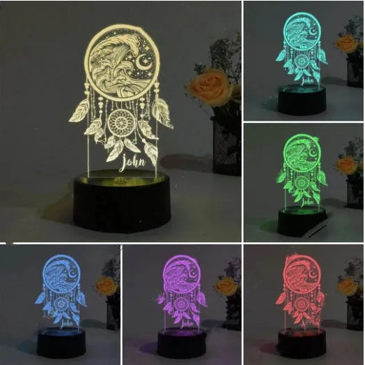 Black-based acrylic table lamp with colourful LED light effects on a desk, showing remote control.