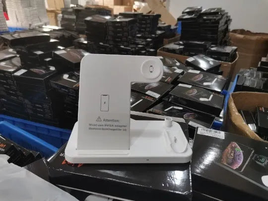Folding 4-in-1 wireless charger in space grey colour showing vertical phone charging and Apple Pen slot