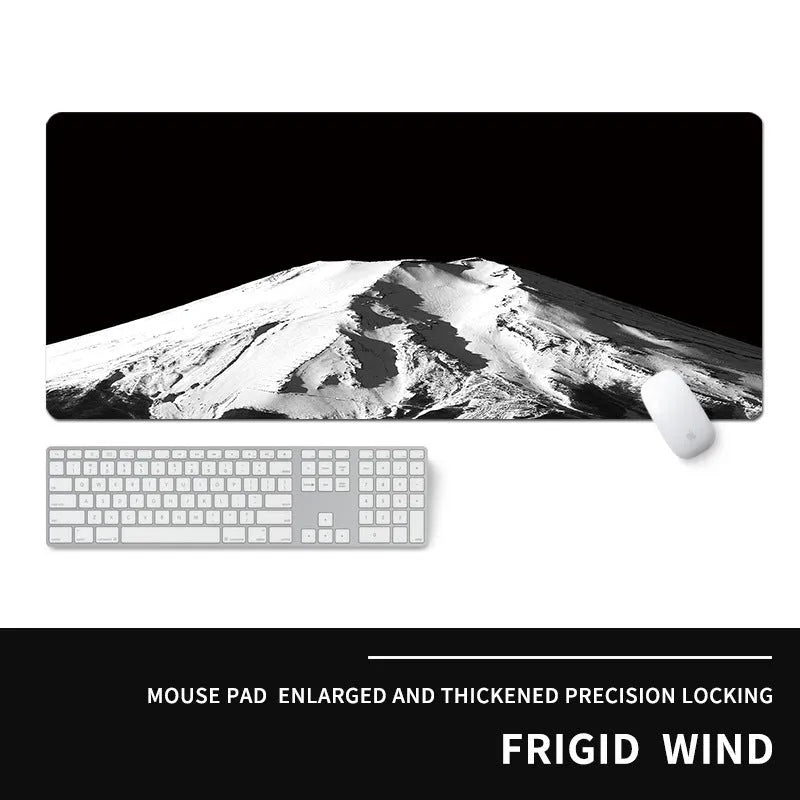 Oversized thick gaming mouse pad with printed e-sports design on a desk with keyboard and mouse.