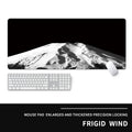 Oversized thick gaming mouse pad with printed e-sports design on a desk with keyboard and mouse.