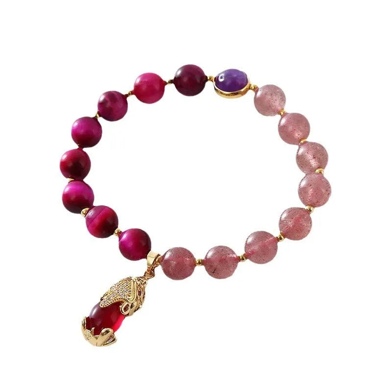 Women's strawberry crystal bracelet on elastic rope showing natural bead texture and uniform 18cm size