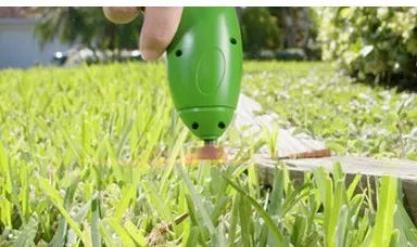 Cordless lawn trimmer tool with extension pole and protective debris shield for garden maintenance