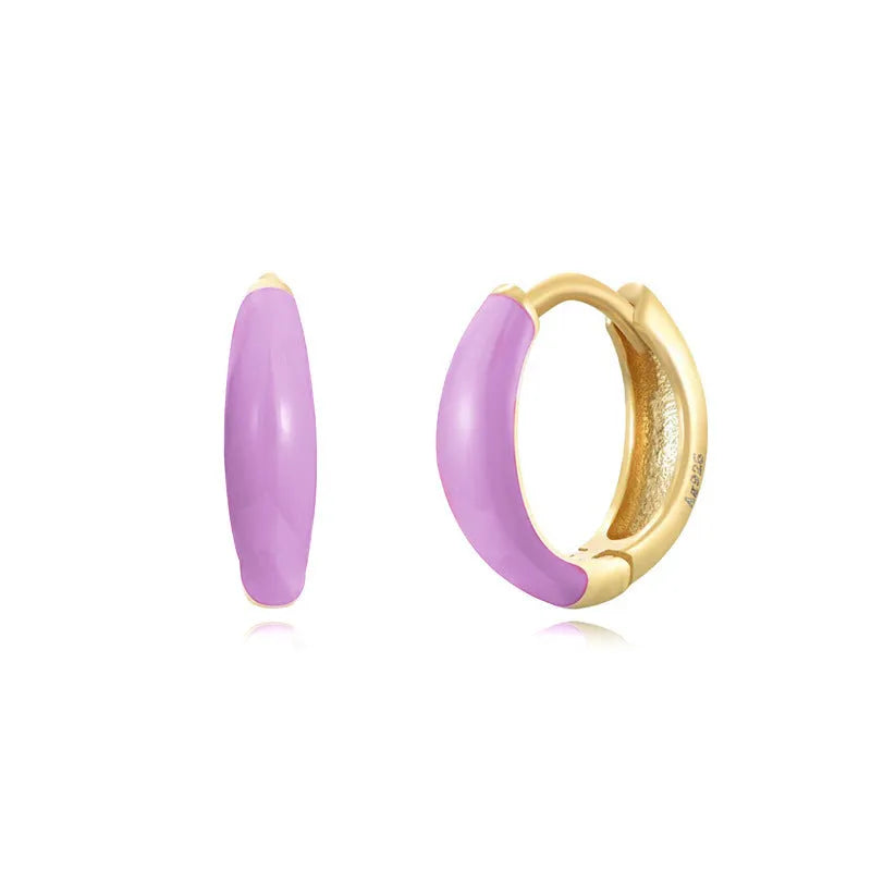 Geometric epoxy resin earrings with dripping oil colour technique showing oval curves and integrated rings