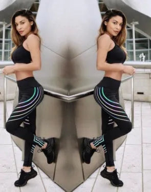 Women's black workout leggings with glowing print pattern, slim fit design