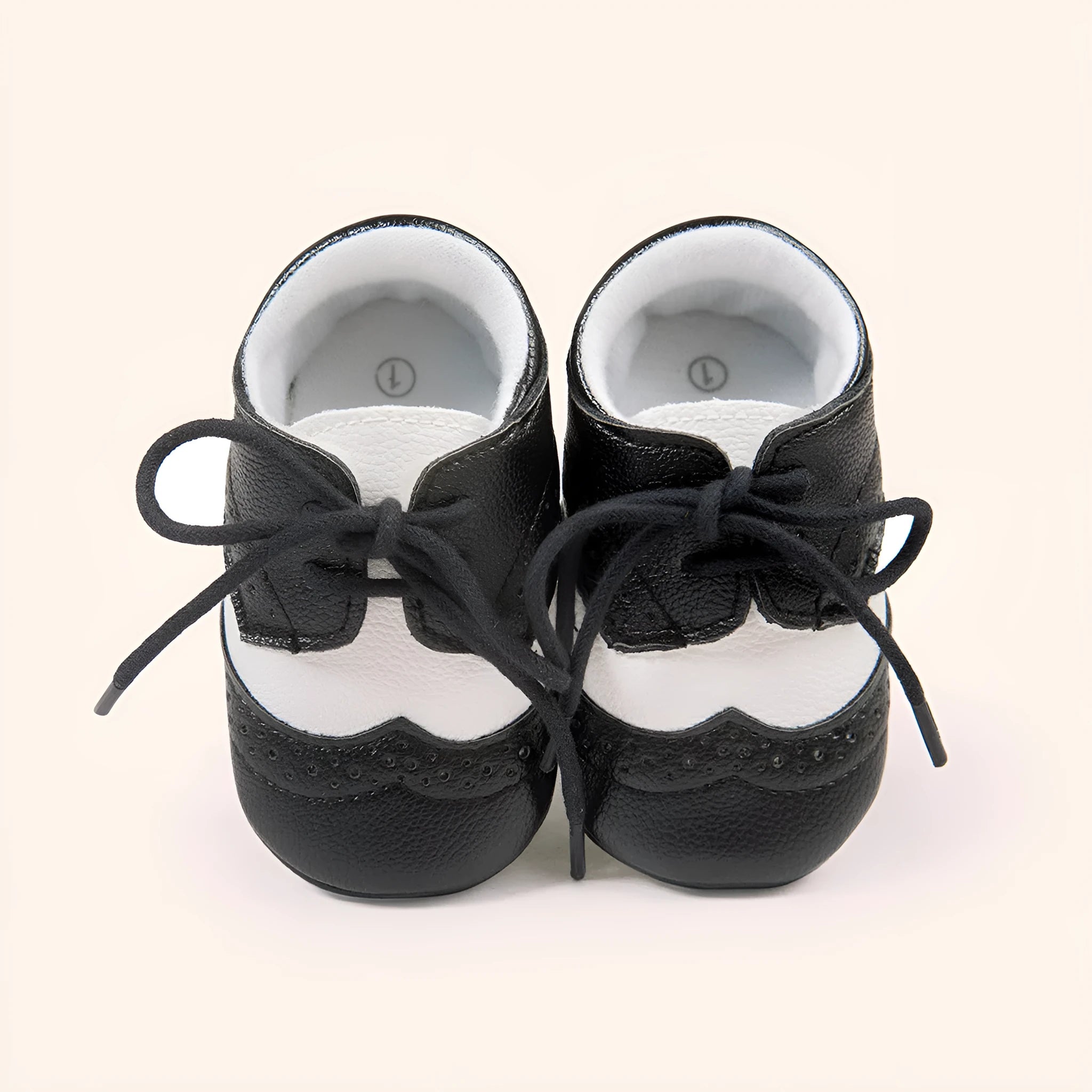 Vintage-style baby walking shoes with soft soles and synthetic leather upper in four colours