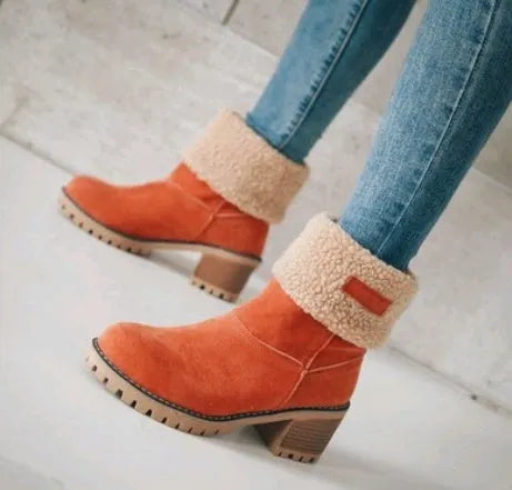 Women's suede mid-calf snow boots with a thick low heel and round toe in various colours.
