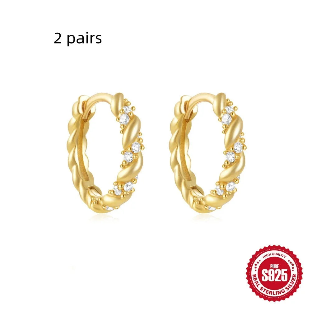 Sterling silver geometric stud earrings with diamond detailing in gold or silver finish
