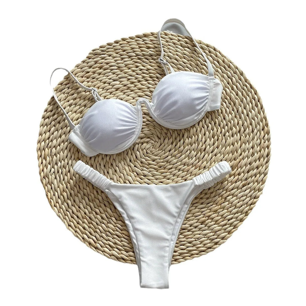 Women's black underwire bikini swimsuit on a mannequin, showing brief style and supportive fit.
