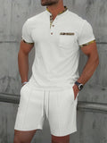 Men's grey summer suit with polo collar short sleeve jacket and matching shorts on hanger