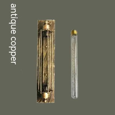 Industrial retro iron wall lamp in antique bronze finish showing flute design.