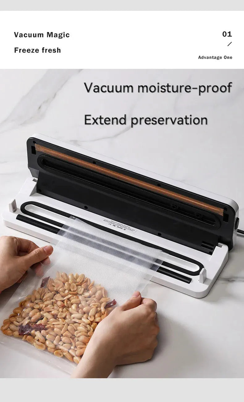 Black compact automatic vacuum sealing machine for home food preservation on a kitchen counter.