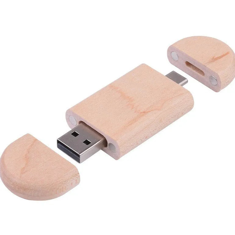 Custom engraved maple wood USB flash drive with Type-C connector for mobile phones on a wooden box.