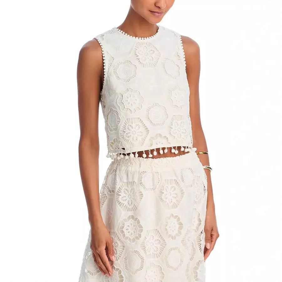White women's sleeveless top and long skirt suit with retro embroidery detail on polyester fabric