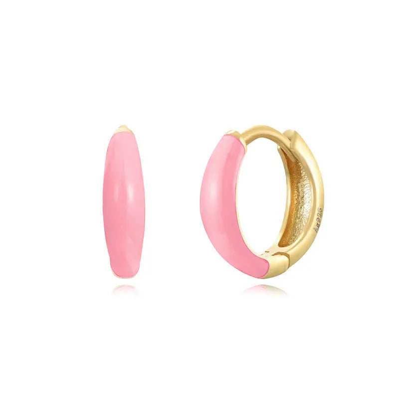 Geometric epoxy resin earrings with dripping oil colour technique showing oval curves and integrated rings