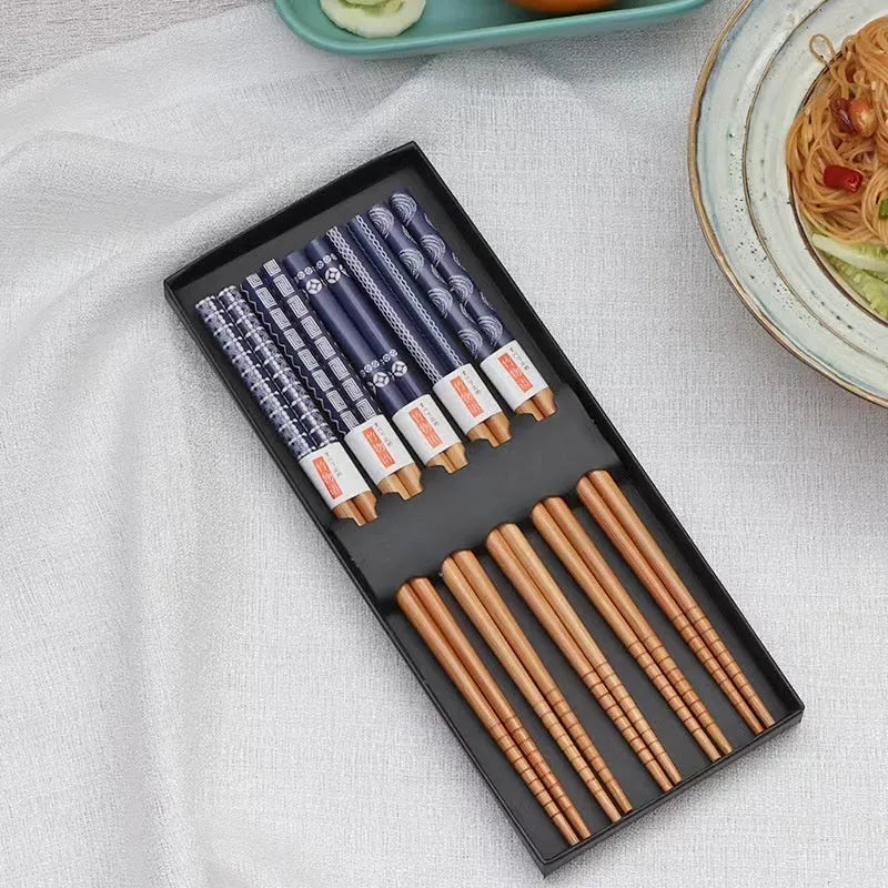 Set of Japanese-style patterned bamboo chopsticks showing lucky cat and elegant blue designs with gift box packaging