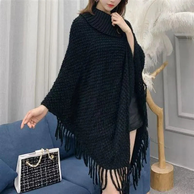 Women's casual plush triangle shawl cape with tassel details in a cashmere and acrylic fabric blend.