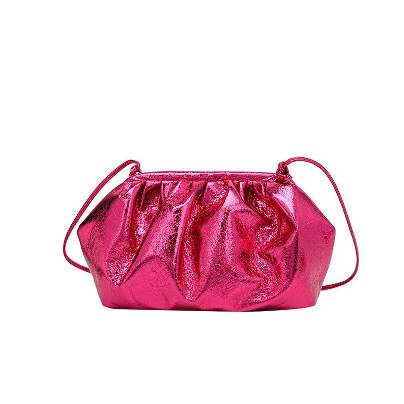 Shell-shaped shoulder crossbody bag with hair clip closure in rose red colour showing interior organisation compartments