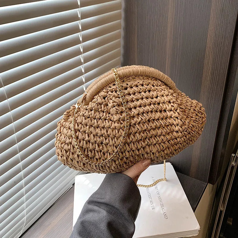 Women's straw beach shoulder bag in khaki colour with chain detailing and shell shape