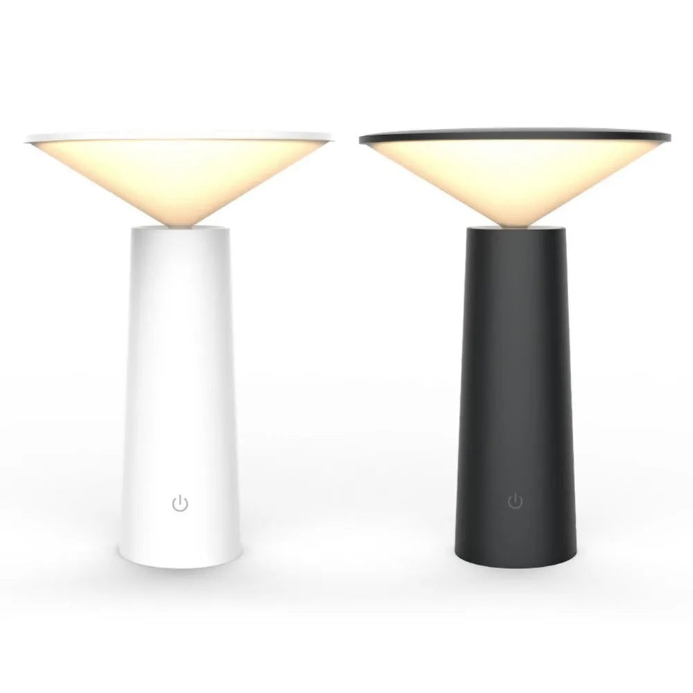 Black USB touch sensor reading lamp with tilted head on a wooden desk