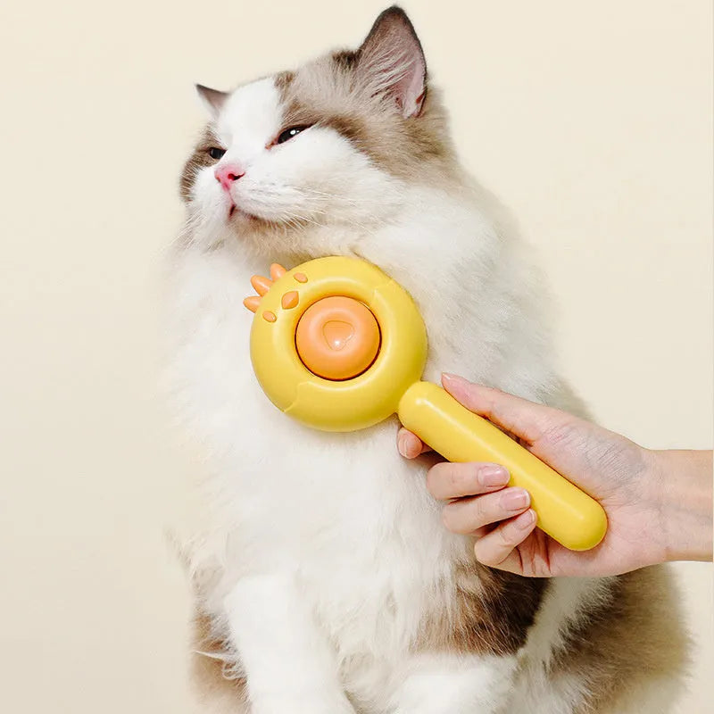 Purple pet grooming brush with self-cleaning button and stainless steel bristles on a white background