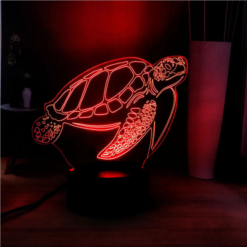 3D green turtle shaped LED night light glowing with multi-colours on a wooden table.