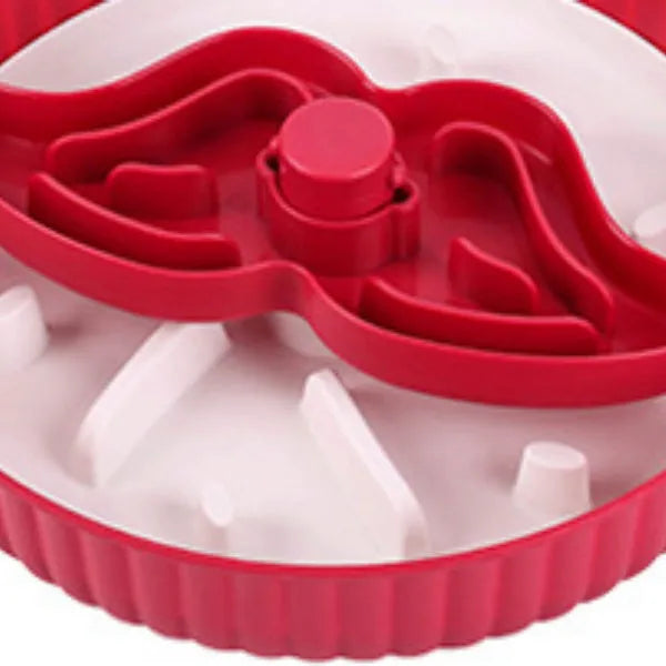 Grey rotating pet slow feeder bowl with a blue silicone windmill-pattern licking mat attached.